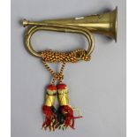 A reproduction brass bugle, 10¼” long.