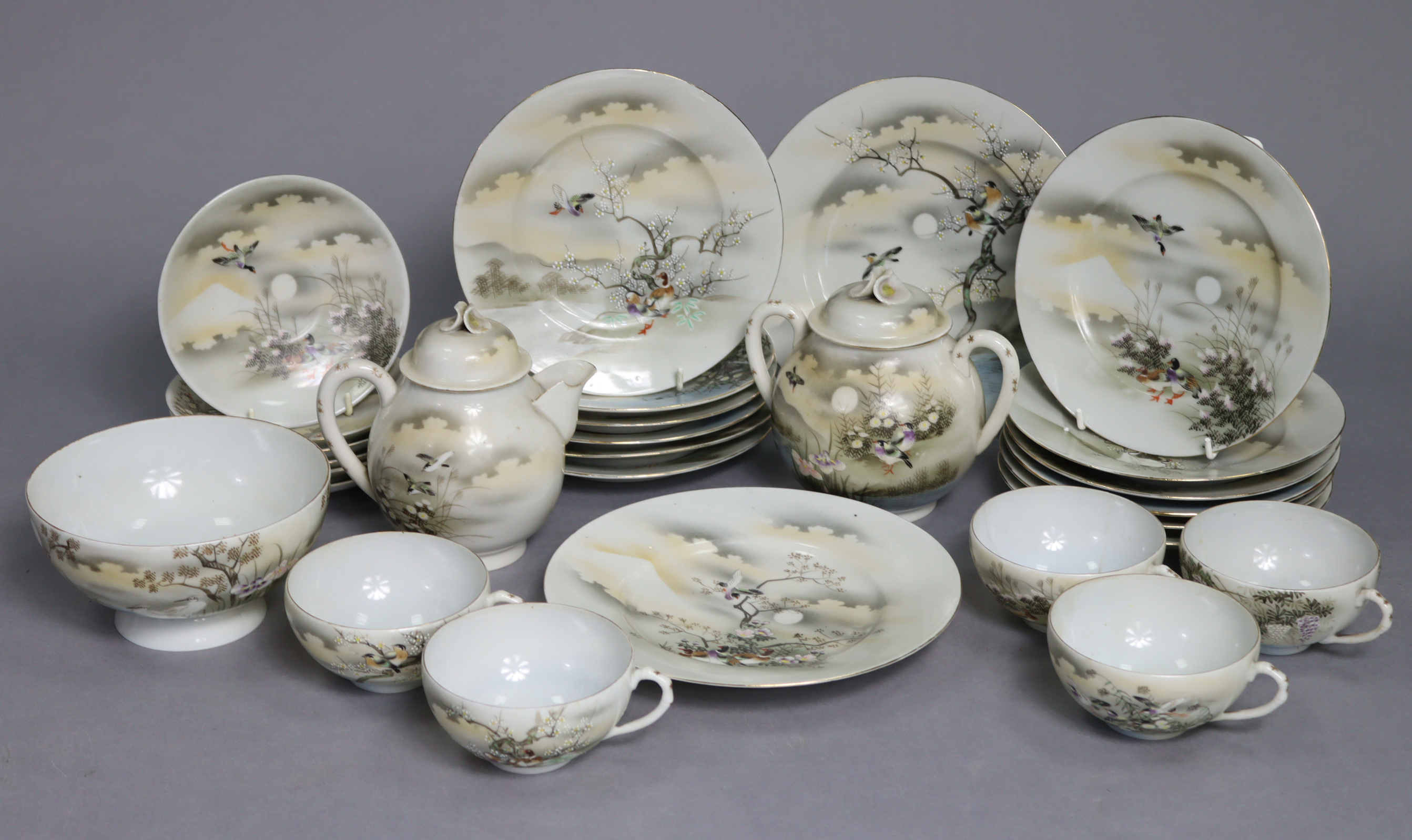 A Japanese egg-shell twenty-eight piece part tea service of white ground, & with multi-coloured