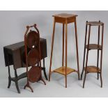 An Edwardian mahogany folding cake stand of three circular tiers, 35” high; together with two