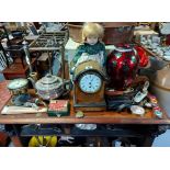 An early 20th century mantel timepiece with 3½” diameter white enamel dial, & in mahogany domed-