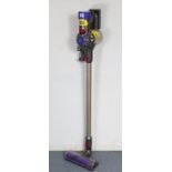 A Dyson “V8 animal” cordless stick vacuum cleaner.