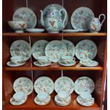A Japanese porcelain thirty-four piece part tea service of white ground, & with multi-coloured