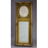 A reproduction gilt frame pier glass inset white composition oval plaque to the top depicting a