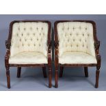 A pair of 19th century-style carved hardwood-frame easy chairs with buttoned-backs & sprung seats
