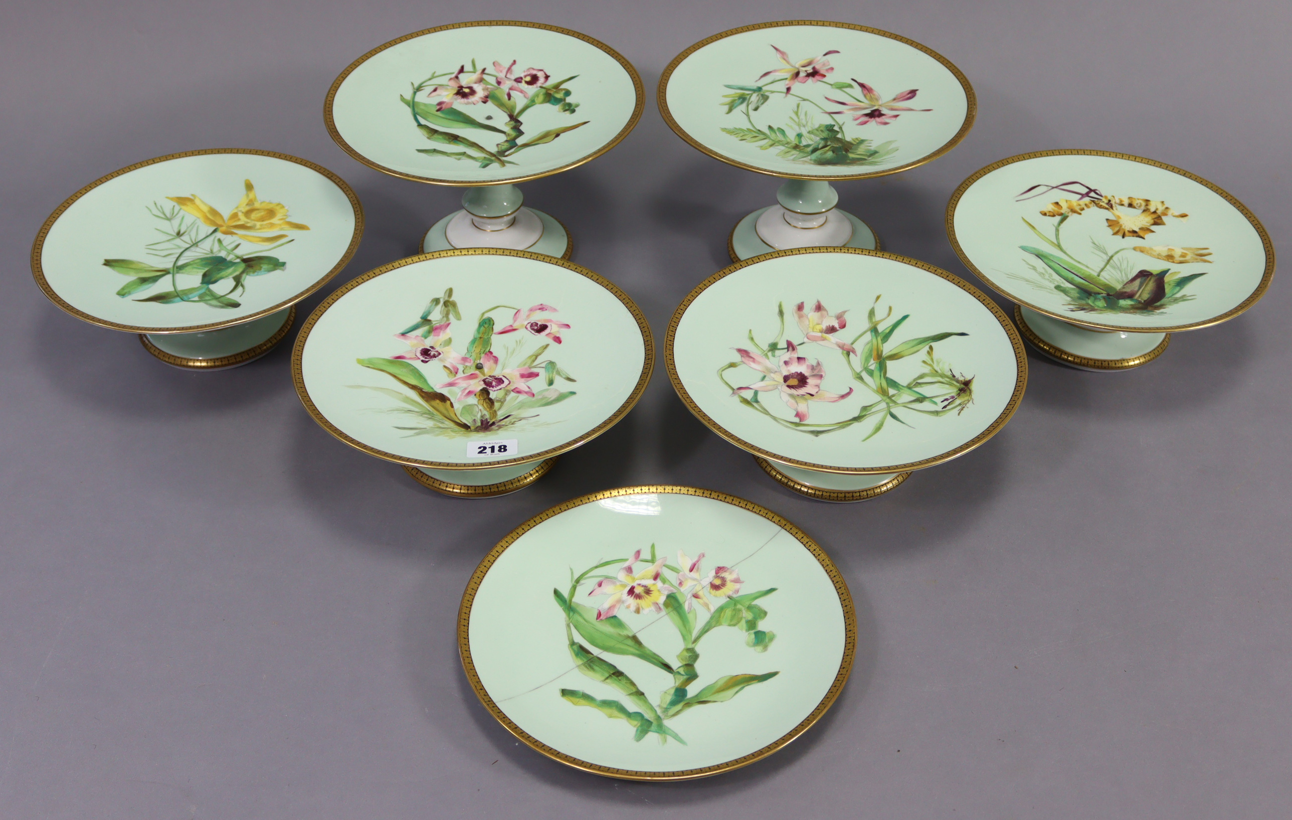 A late 19th century seven-piece part china dessert service comprising of two tall comports, four low