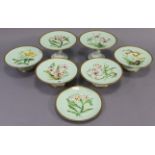 A late 19th century seven-piece part china dessert service comprising of two tall comports, four low