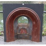 A cast-iron fire insert, 37” wide x 37” high.