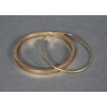 Two 9ct. gold stiff bangles, total weight 20.7gm.