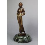 An art deco-style spelter female figure signed “Lorenzl”, mounted on a simulated marble plinth, 7¼