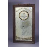 A vintage rectangular wall mirror “We Sell the celebrated Falcon Make Headwear”, 21½” x 12¼”,