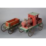 A mid-20th century painted wooden pull-along train& tender, 48” long (over-all).