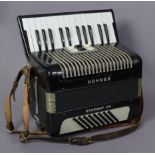 A Hohner “Student VM” piano accordion in black polished case, 13¼” wide.