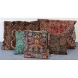 Five various Persian pattern scatter cushions.