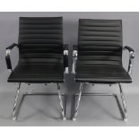 A pair of silvered-metal & black leatherette office elbow chairs.