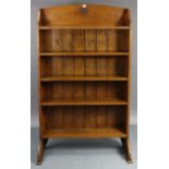 An Edwardian oak five-tier standing open bookcase, 36” wide x 60½” high.