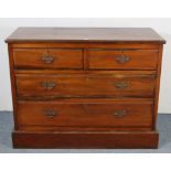 A late Victorian walnut dwarf chest fitted two short & two long graduated drawers with brass swing