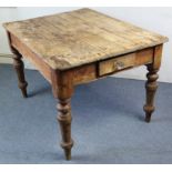 A pine kitchen table with rounded corners to the rectangular top, fitted end drawer, & on four