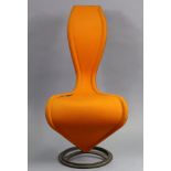 A Tom Dixon “Cappellini 5” contemporary occasional chair upholstered orange material, & on a