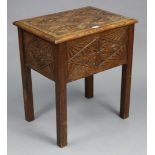 A carved oak box-top stool with a hinged lid, & on four square legs, 20” wide x 22” high x 14½”