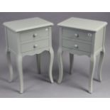 A pair of continental-style pale blue painted wooden bedside tables each fitted two long