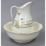 A late Victorian toilet jug & basin of white ground & with multicoloured floral banded decoration.