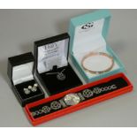 A pair of 9ct gold gem-set earrings; two pairs of cultured pearl ditto; a Swatch ladies’ wristwatch;