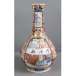 A Japanese Imari porcelain bottle vase painted with figure scenes, phoenix & flowers, 12½” high; & a