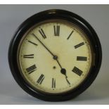 A late 19th century ebonised circular wall timepiece, the 12” dial with Roman numerals, single fusee