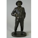 PAUL D’AIRE (French, fl. 1890-1910). A bronze sculpture of a laughing gentleman, standing on oval