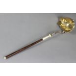 A continental silver ladle (possibly Austro-Hungarian) with wooden & ivory handle, floral-twist