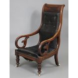 A William IV mahogany frame library armchair with padded buttoned tall back & sprung seat