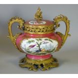 A mid-19th century English porcelain & ormolu-mounted vase & cover of squat round form, with