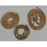 A 9ct gold rope-twist watch chain, 66cm long, 9.7g; & two yellow metal chains (one of snake-links,