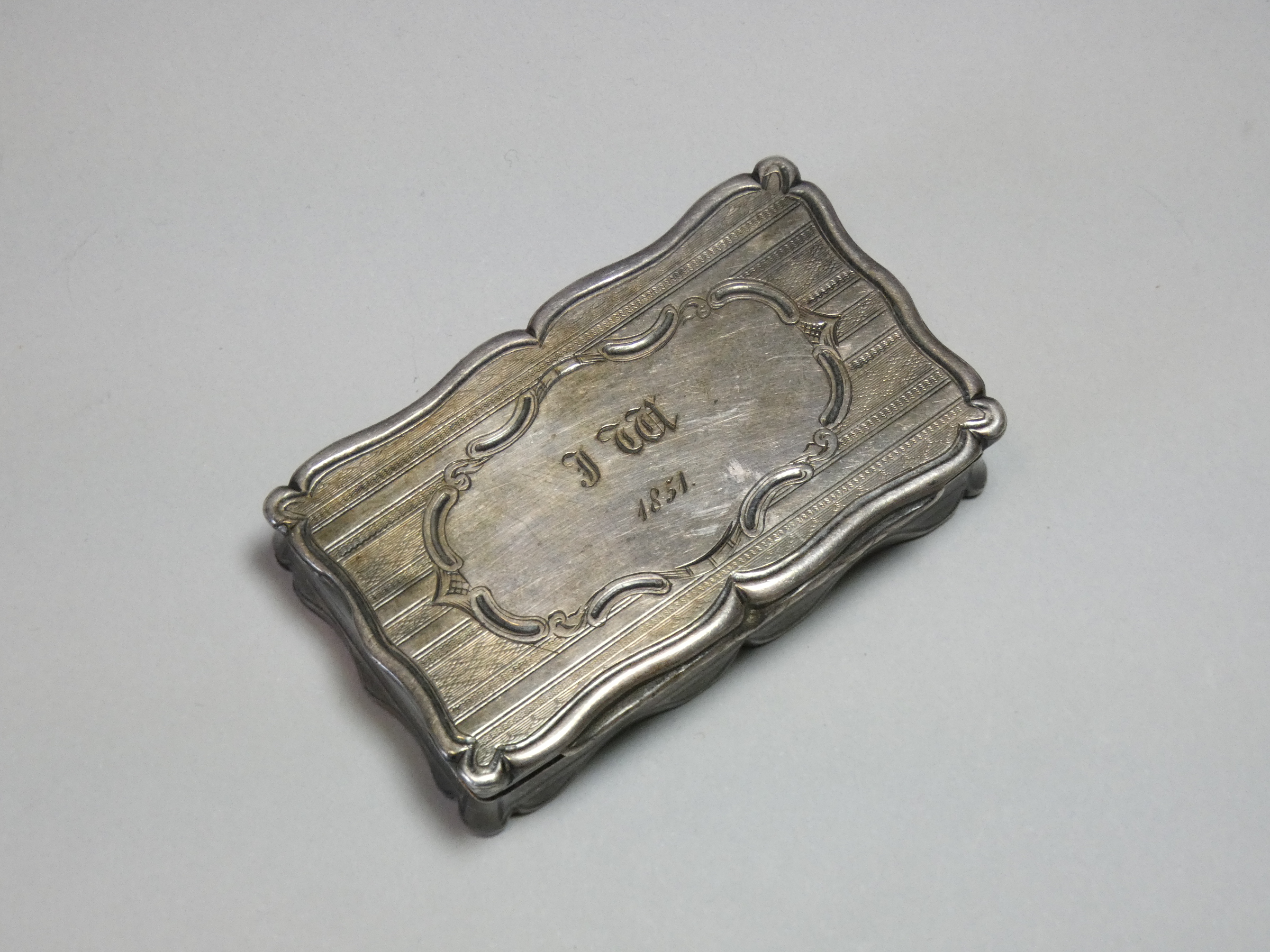 A Victorian silver snuff box, of shaped rectangular form with engine-turned decoration, engraved - Image 2 of 5