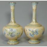 A pair of Royal Worcester porcelain vases with squat round bodies & tall narrow necks, apricot