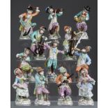 A SET OF TWELVE DRESDEN (POTSCHAPPEL) PORCELAIN MONKEY-BAND FIGURES, each dressed in 18th century