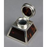 A silver & tortoiseshell inkwell of square tapered form, with hinged lid, Birmingham 1921 by Percy