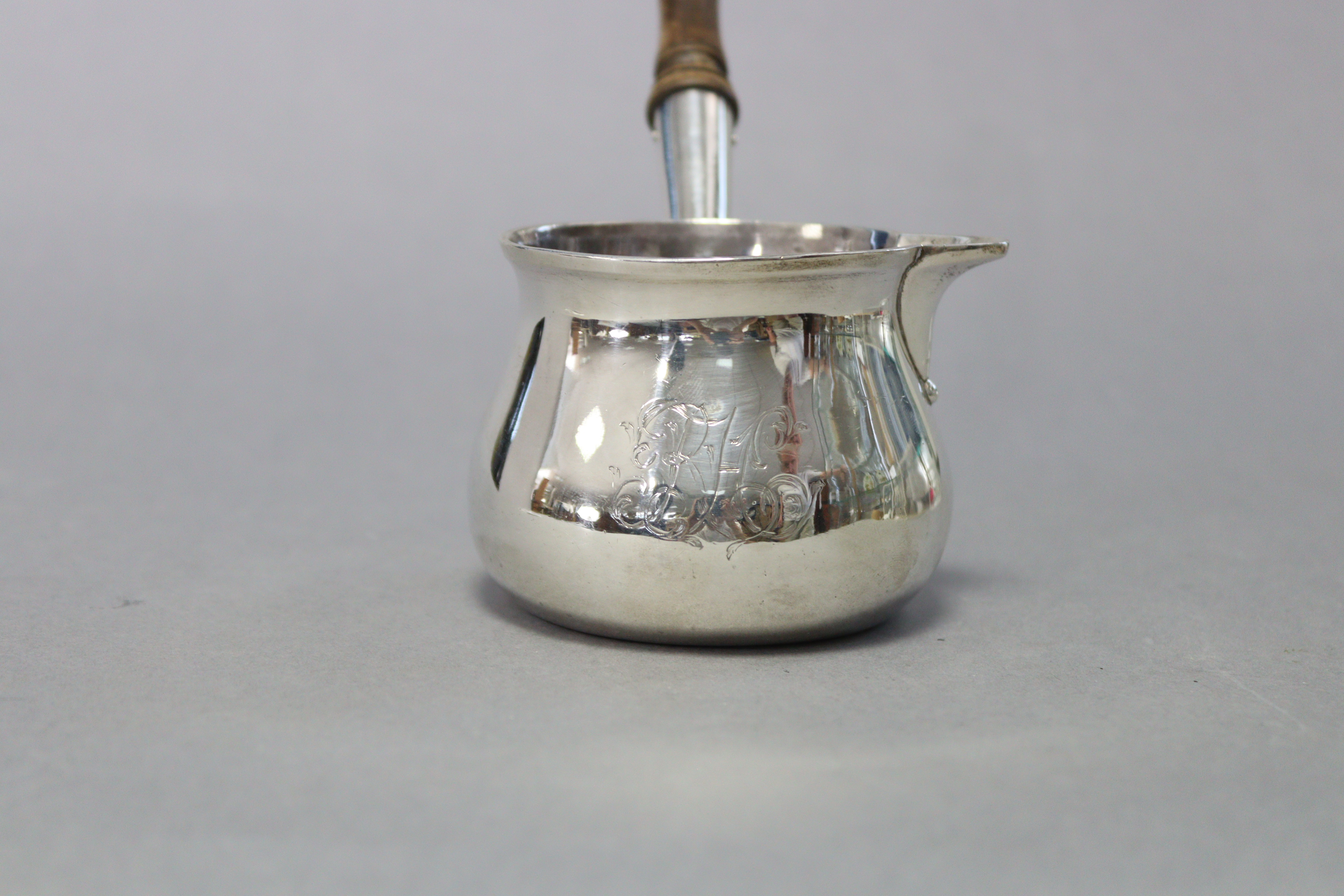 An early George III silver brandy saucepan of squat round shape, with engraved monogram & turned - Image 2 of 3