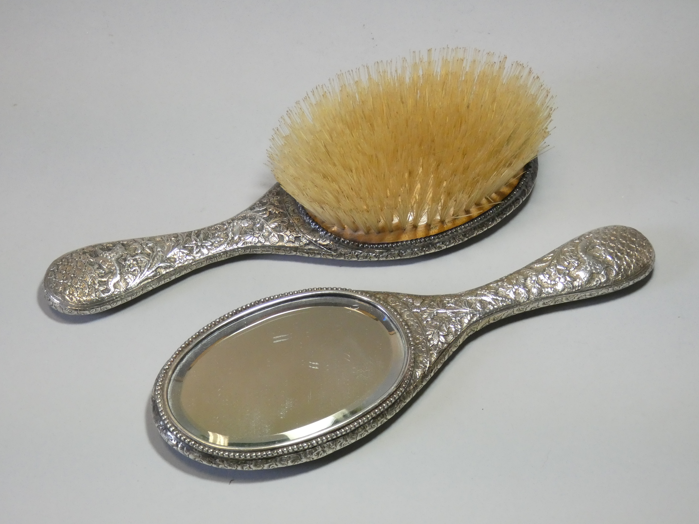 A late 19th/early 20th century Indian silver-backed hand mirror & matching hairbrush, with all- - Image 4 of 4
