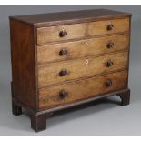 An early 19th century mahogany chest of two short & three long graduated drawers with turned