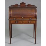 An Edwardian inlaid mahogany small cylinder-front desk, with fitted interior & retractable writing