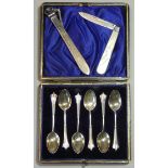 A set of six George V silver Albany pattern coffee spoons with fancy terminals, in fitted case;