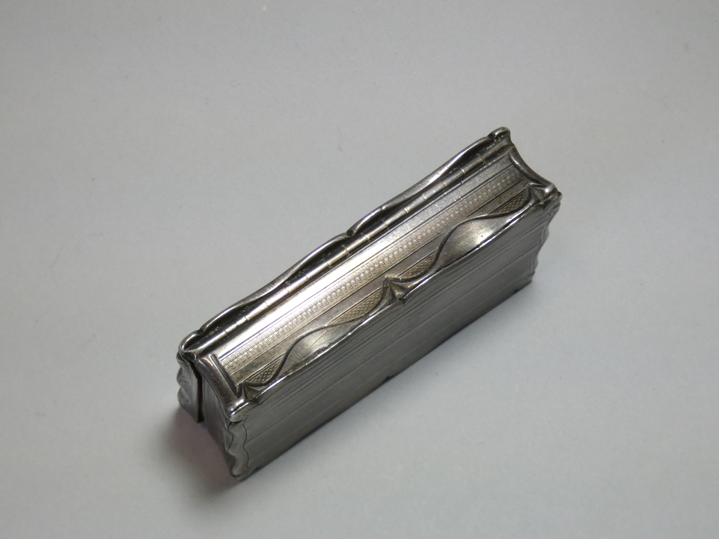 A Victorian silver snuff box, of shaped rectangular form with engine-turned decoration, engraved - Image 4 of 5