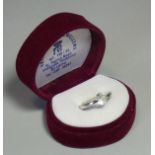 A white sapphire ring, the single round-cut stone weighing approx. 2carats, set to a white metal