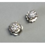 A pair of diamond ear studs, each round-cut stone weighing approx. 0.2carat, set to 18ct white