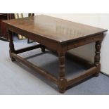 A VICTORIAN OAK REFECTORY TABLE, with rectangular overhang top, fitted frieze drawer to one end,