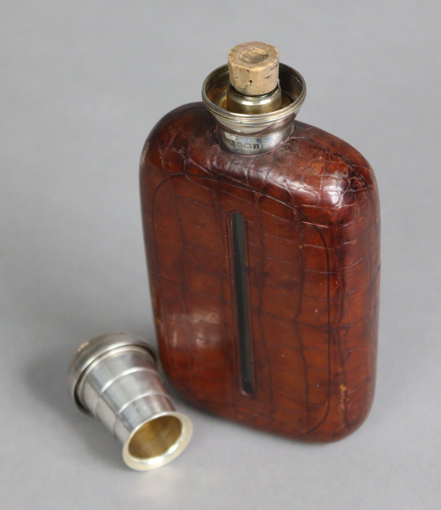 A George V NOVELTY SILVER-MOUNT GLASS SPIRIT FLASK, covered in tan crocodile skin case, the silver - Image 2 of 4