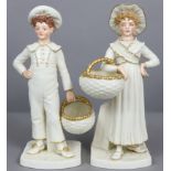 A pair of Royal Worcester porcelain “Kate Greenaway” type standing boy & girl figures in ivory &