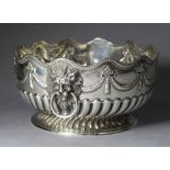 A VICTORIAN SILVER PUNCH BOWL with waved gadrooned rim, the sides embossed with swags, lion-mask &