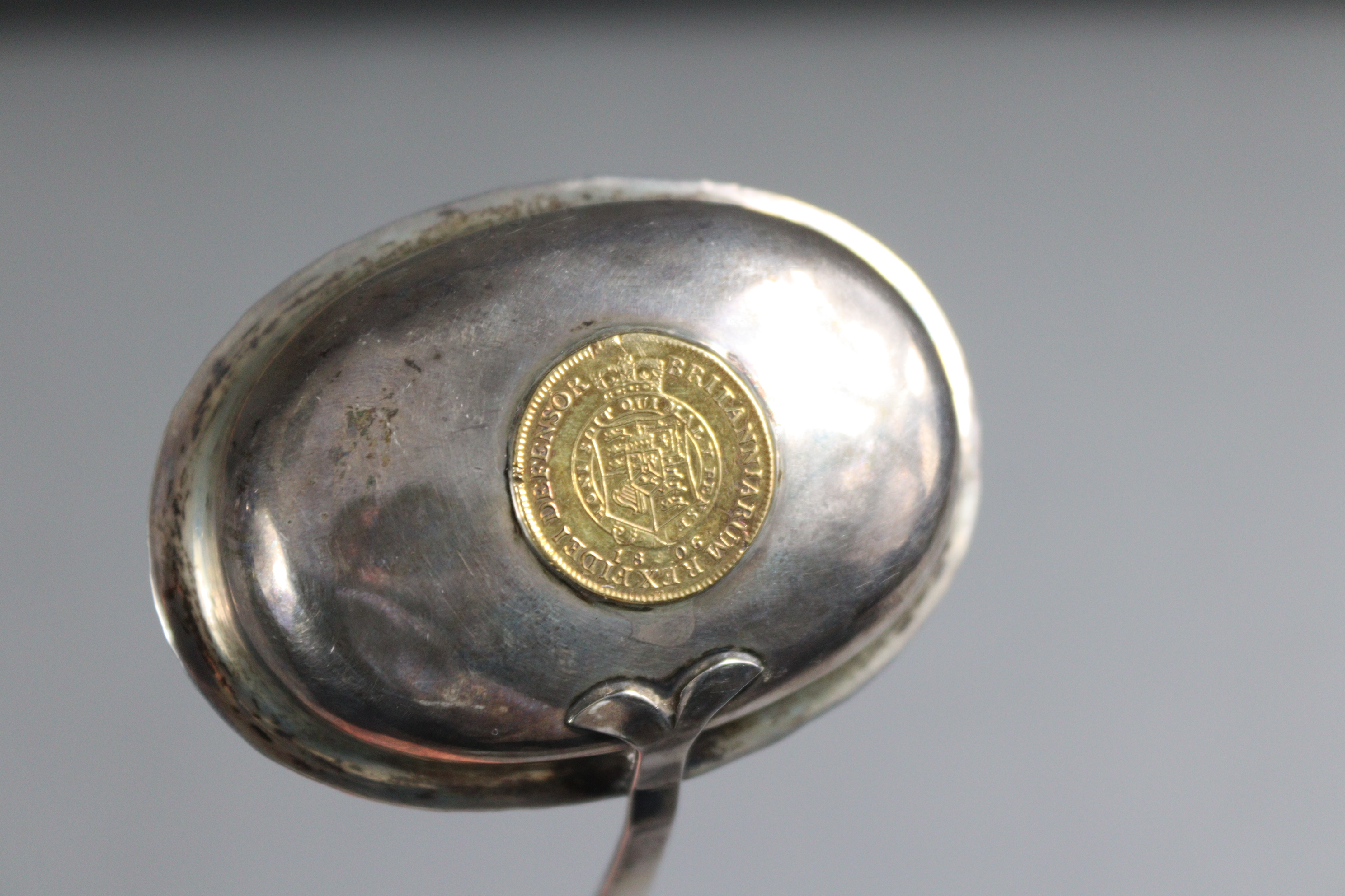 A silver toddy 'coin' ladle with spiral-twist whalebone handle, inset George III half guinea to the - Image 4 of 5